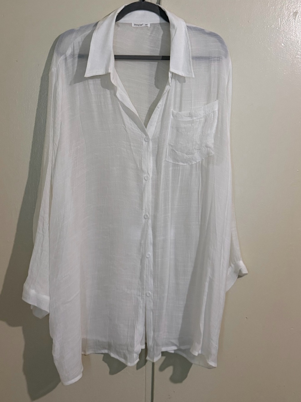 White cover up.  Soft and breezy. Perfect for poolside or cruise.